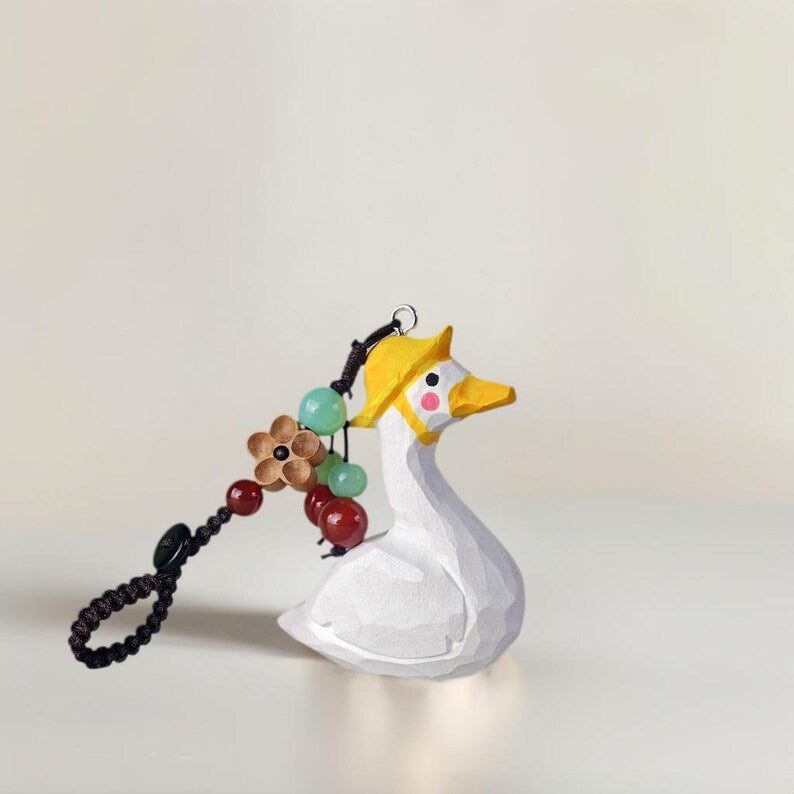 Handgeschnitzter hölzerner Enten-Taschenanhänger mit Kristallperlen